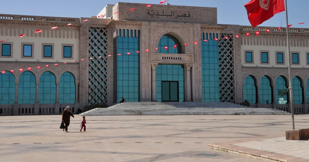 A Tunisian bank branch facade with property documents on a desk